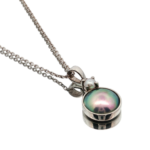 Pearl necklace NZ â€“ Arapawa paua pearl paired with freshwater pearl in sterling silver setting