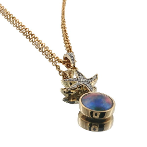 18ct yellow gold paua pearl necklace with a round 8mm pearl and diamond setting
