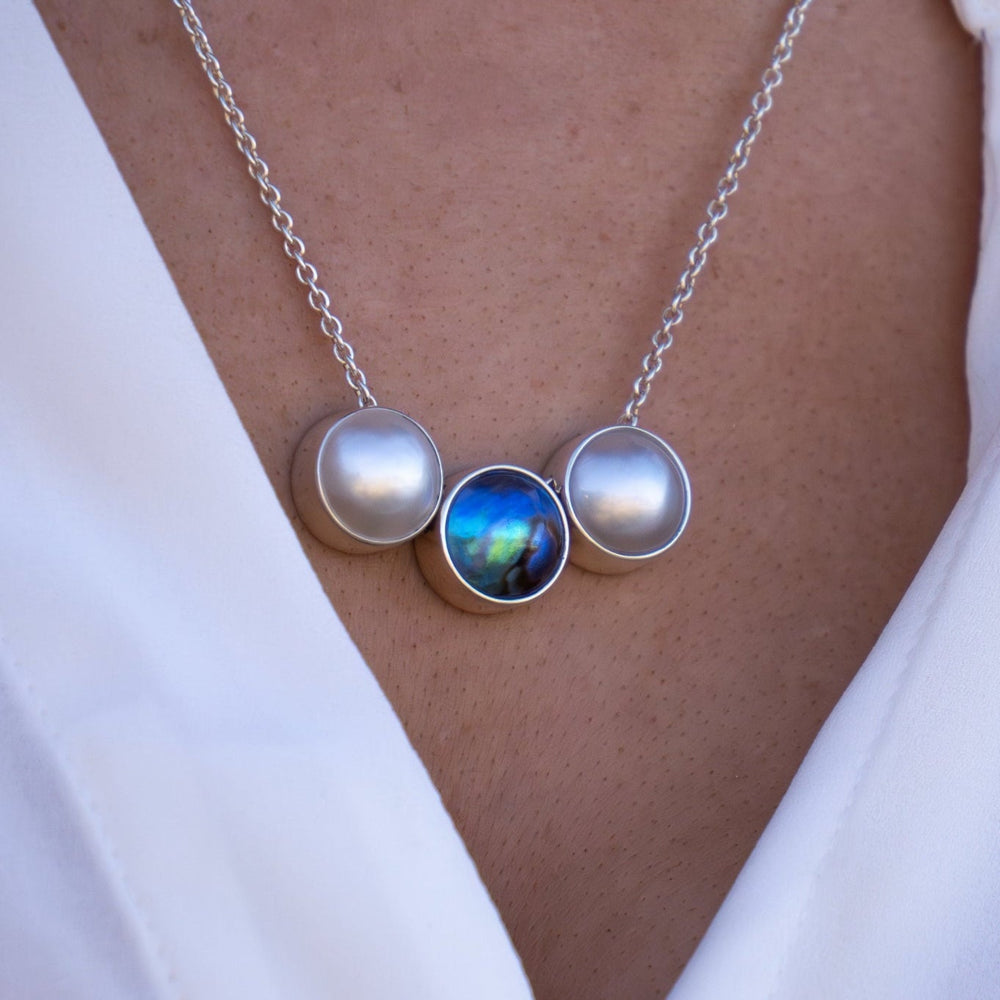 Sterling silver pearl necklace NZ featuring a 12mm pāua and 12mm white pearl duo pendant