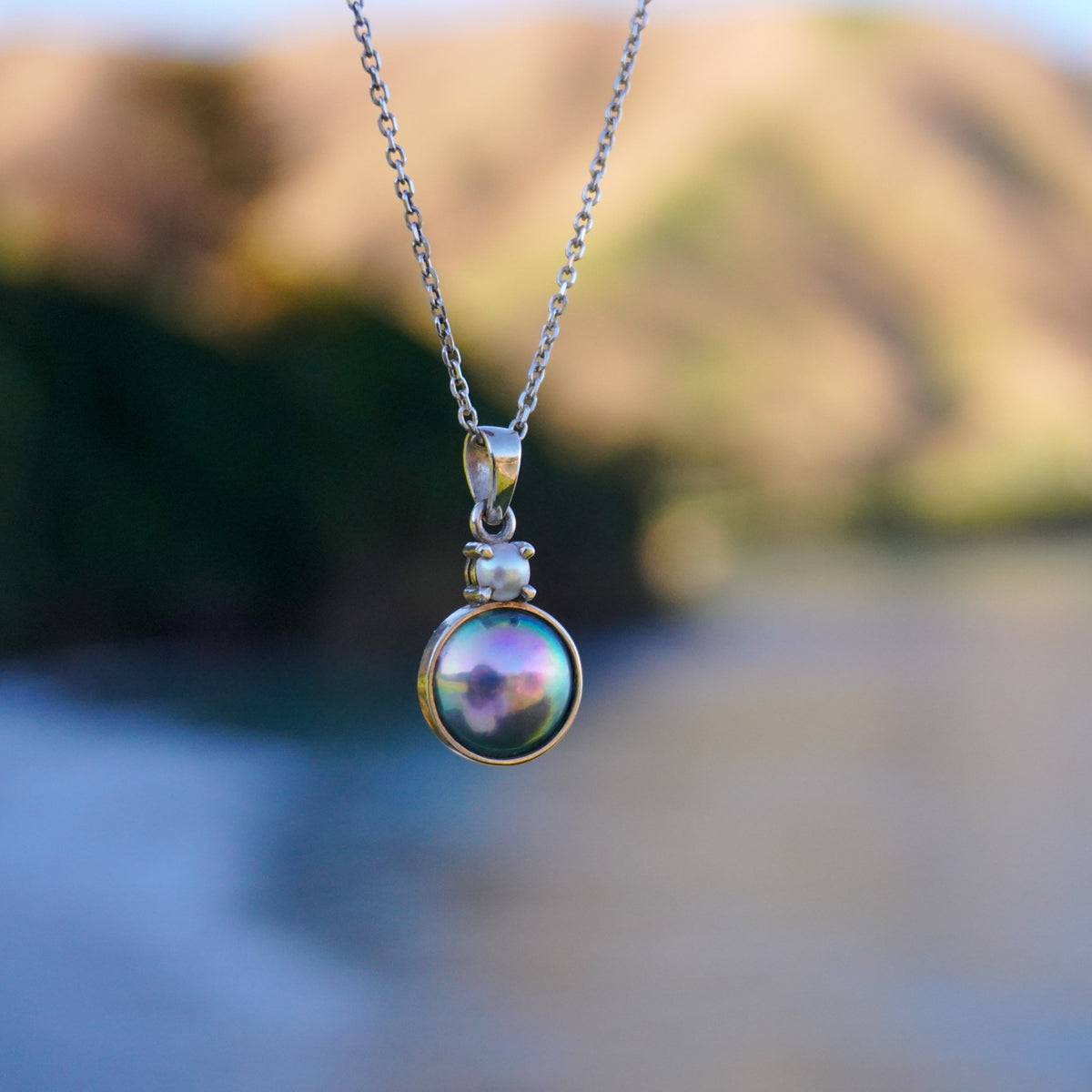 Arapawa paua pearl necklace NZ with freshwater pearl accent, front view